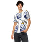 A man modeling a white short-sleeve t-shirt with a blue and white porcelain-style grenade print featuring large grenade motifs, paired with dark gray jeans against a plain white background.