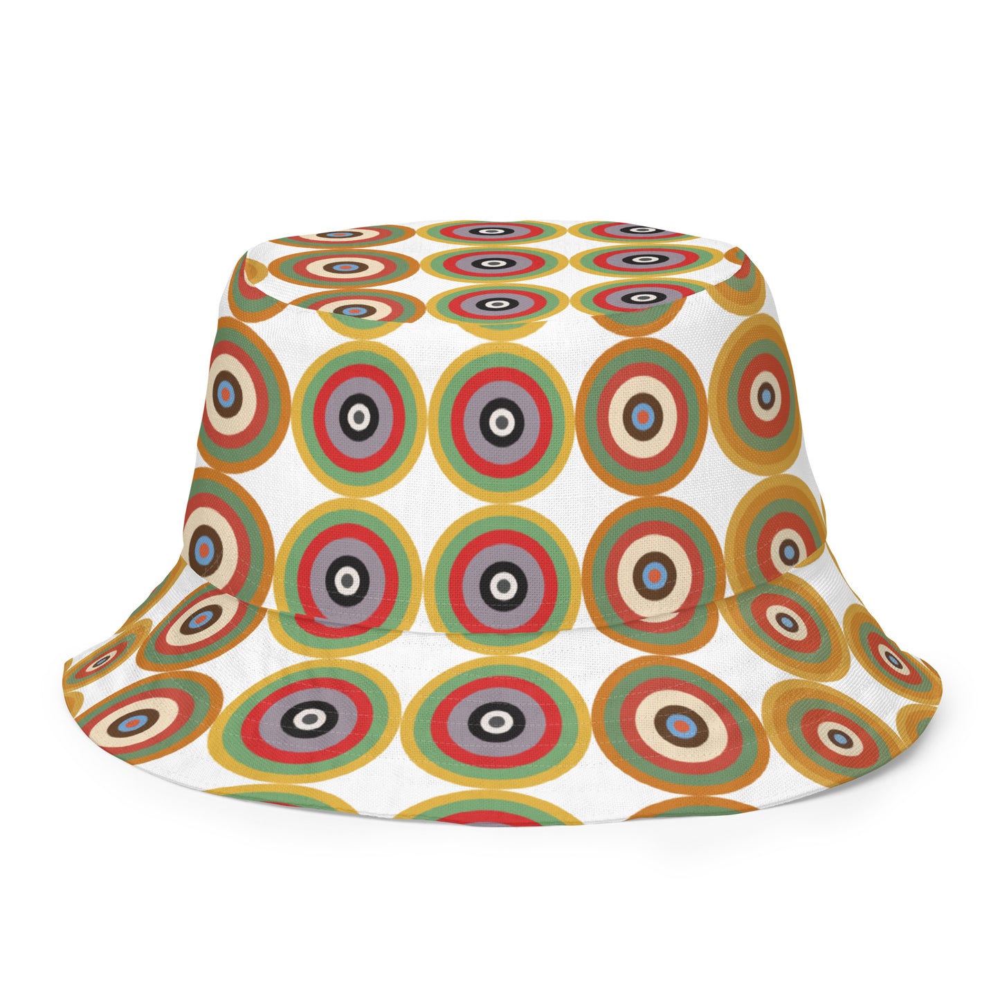 A bucket hat featuring a retro circular target pattern on the crown in shades of green, red, brown, and beige on a white background, with a colorful geometric pattern on the inside. Reversible and breathable.