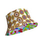 A bucket hat featuring a retro circular target pattern on the crown in shades of green, red, brown, and beige on a white background, with a colorful geometric pattern on the inside. Reversible and breathable.
