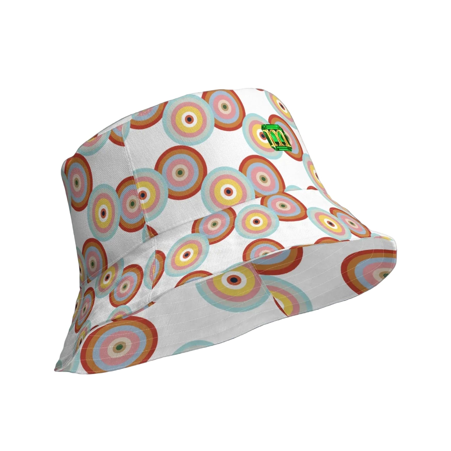A white bucket hat featuring a colorful retro concentric circle pattern in shades of orange, red, yellow, green, and blue, with a small green logo on the side.