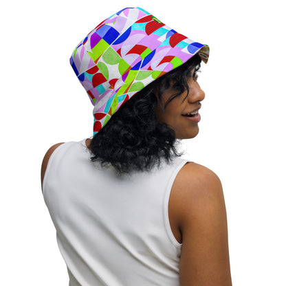 Person wearing a colorful geometric-patterned bucket hat on a white background