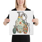 A square canvas wall art print featuring a stylized illustration of three hand grenades with colorful mid-century patterns, shown being held by a woman in a black tree.