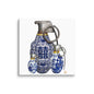 A square canvas wall art print featuring three ceramic grenade-shaped figures decorated with blue and white porcelain-style patterns and yellow accents, shown against a plain white background.