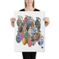 A woman holds up a square canvas print featuring an illustration of multiple colorful hand grenades with traditional patterns, set against a plain white background.