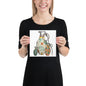 A woman wearing a black t-shirt holds up a square print featuring a colorful graphic illustration of three hand grenades with mid-century wallpaper designs on them on a white background.