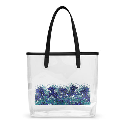 A clear plastic beach tote bag with black shoulder straps and a black top trim, featuring a blue and white wave print on the lower half, shown against a plain white background.