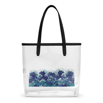A clear plastic beach tote bag with black shoulder straps and a black top trim, featuring a blue and white wave print on the lower half, shown against a plain white background.